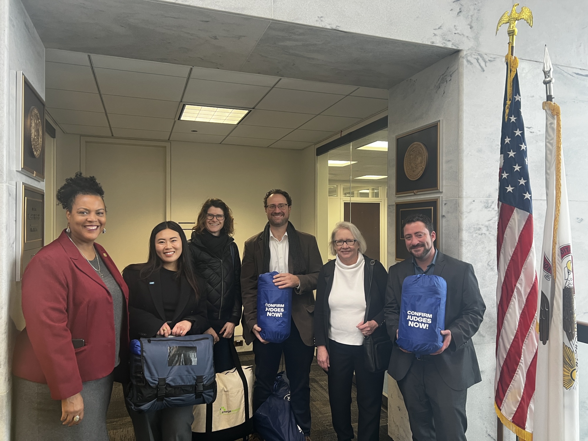 AFJ staff help deliver "Confirm Judges Now!" sleeping bags to senators.