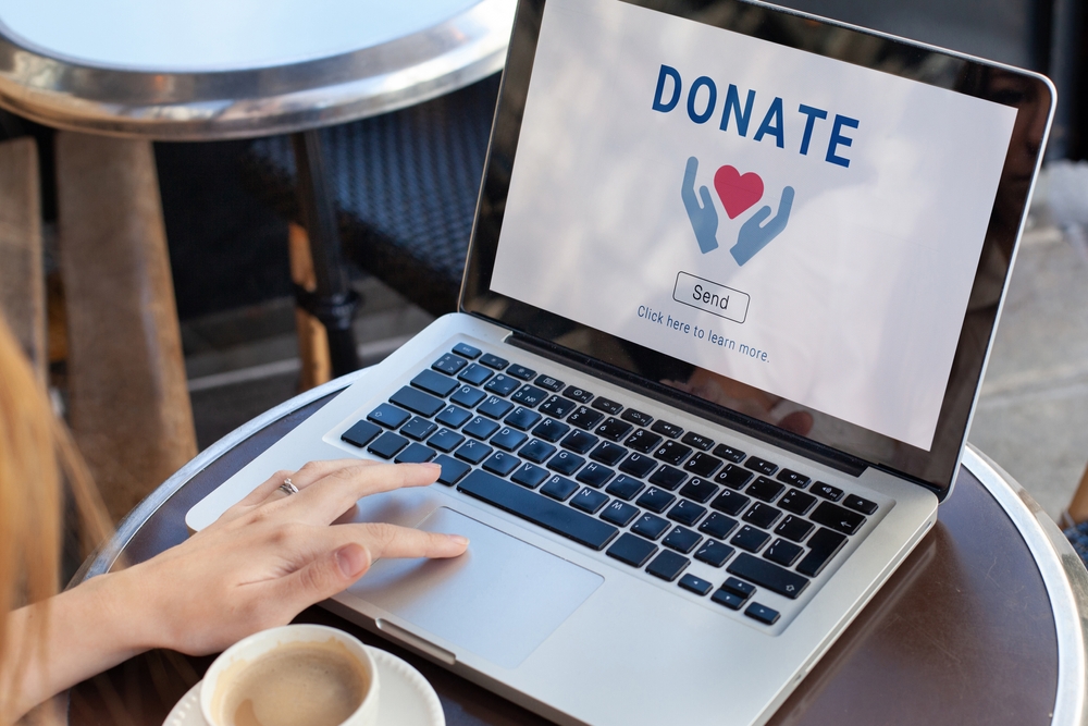 A laptop displaying a nonprofit donation form.