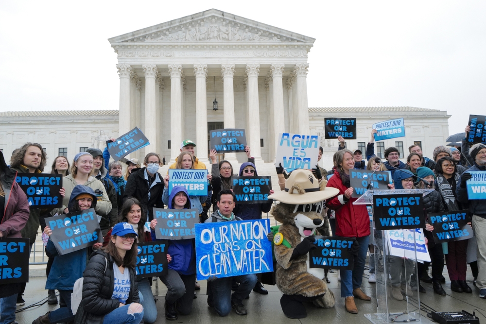 Activists protest in front of the Supreme Court, calling for clean water protections. (2022)