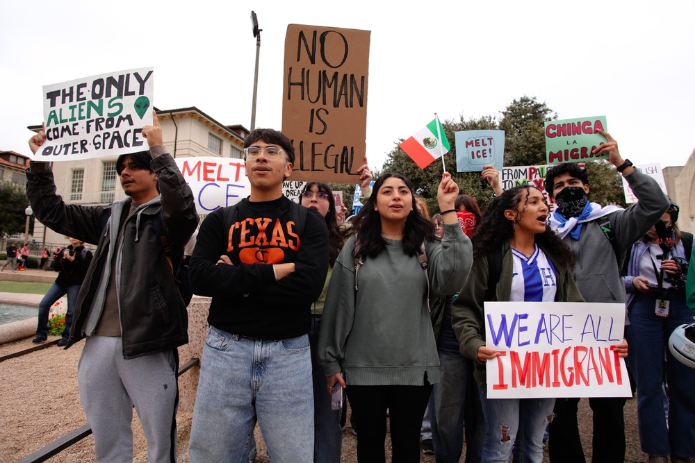 Advocates rally for immigrant rights at a 2025 rally at the University of Texas.